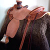 Cow Boss Gullet - 7 -1/2H by 6 - 1/4W by 4, Horn - 3 by 3 inch Round Horn, 94 degree Quarter Horse bars,7/8ths full in skirt riggin, 16 - 1/4 inch seat Cheyenne Roll - 1 - 3/4 inch and decorated with Valleys' Sheridan floral tooling pattern dallied by Valleys' Vaquero Lace border.
